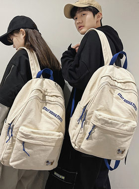 帆布书包女高中大学生背包2022新款小众设计质感大容量双肩包男潮